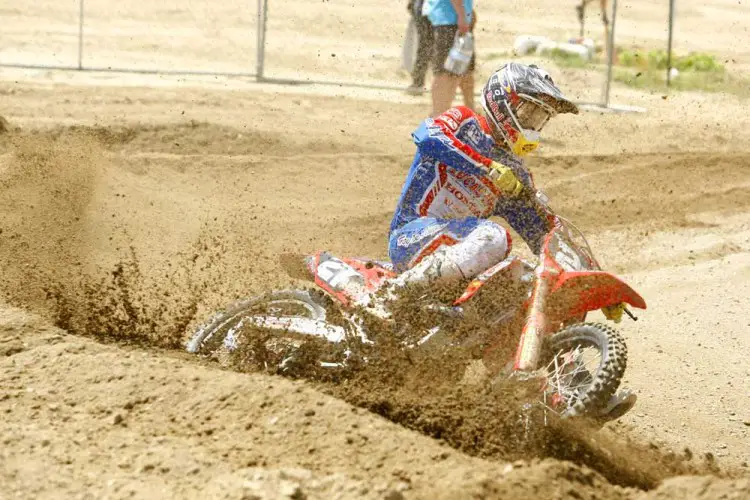 Cole Seely (21) gets sand blasted. This isn't common beach sand, but instead the heavy stuff.