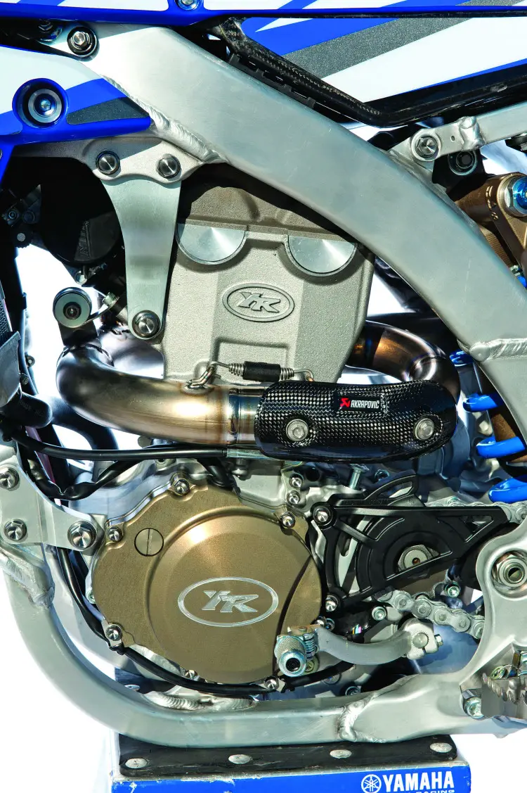 Insiders claim that the YZ250FM uses a dual-injector system along with a GET GPA traction control ECU. The ignition cover is magnesium, and the special cylinder and head are cast at Rinaldi Racing in Italy.Jeremy Van Horebeek’s YZ450FM engine uses more stock parts than Charlier’s YZ250FM, but it still gets the Rinaldi touch when it comes to the piston, cams and crankshaft. It also can be equipped with an electric starter.