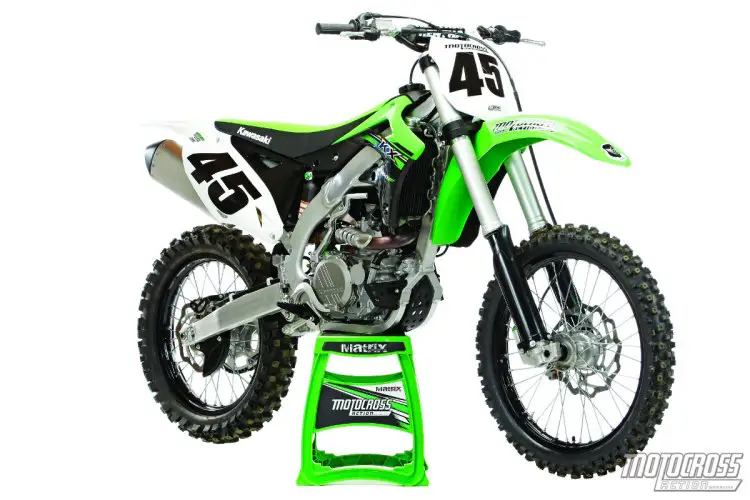 Visually the KX450F has stayed frozen in time almost since its inception, but technically it gets updates almost every year. For 2015 the mods include a bigger front brake, new air forks, traction control and rear axle nut.