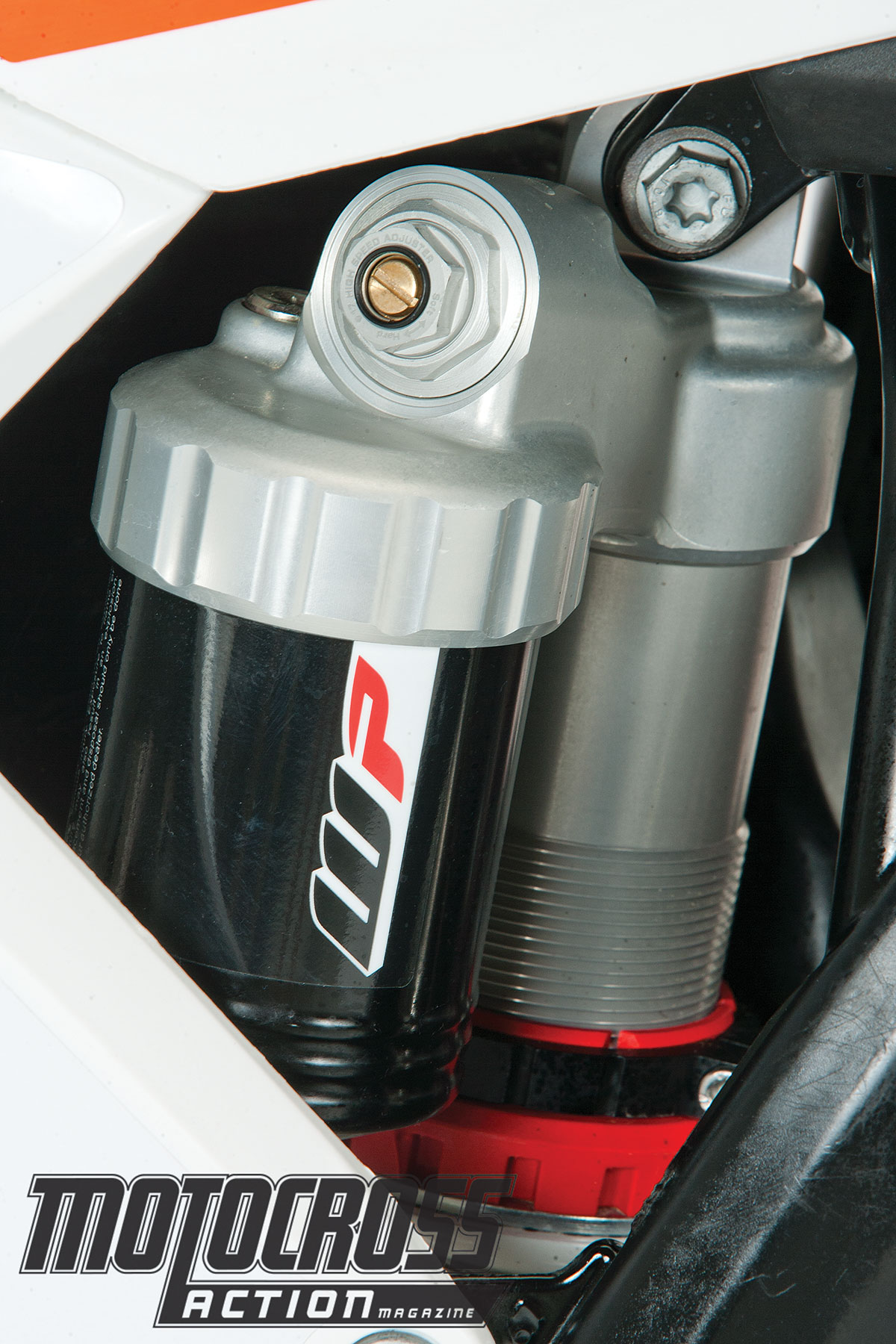 With the exception of the raw aluminum look of the shock reservoir cap, the rear suspension is basically the same.